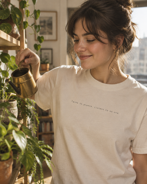 'Talks to plants. Listens to no one.' Organic Cotton Tee